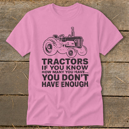 Pink t-shirt with vintage tractor graphic and text: "Tractors If You Know How Many You Have... You Don't Have Enough".