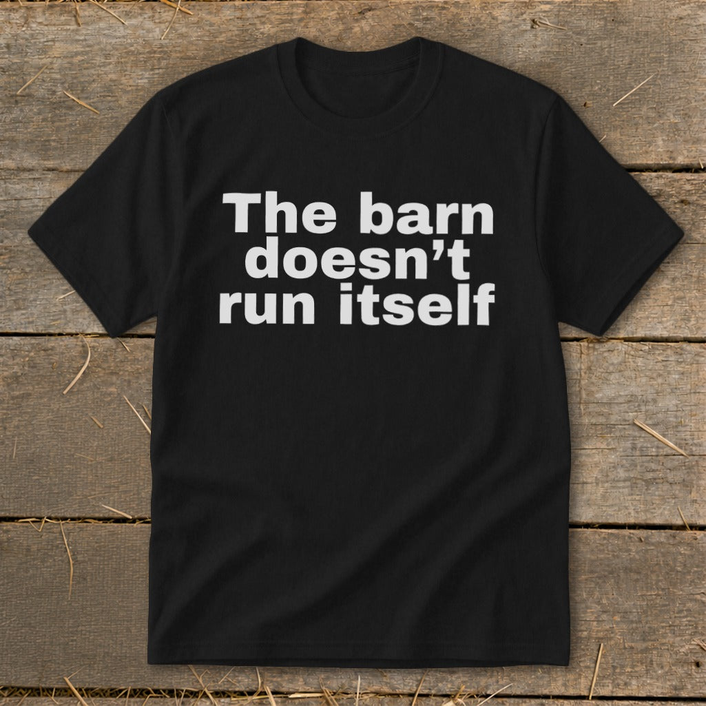 Black t-shirt with white text that reads "The barn doesn't run itself".