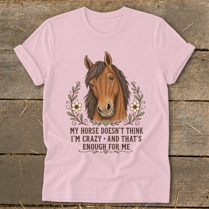 Pink t-shirt with horse illustration and text "MY HORSE DOESN'T THINK I'M CRAZY AND THAT'S ENOUGH FOR ME".