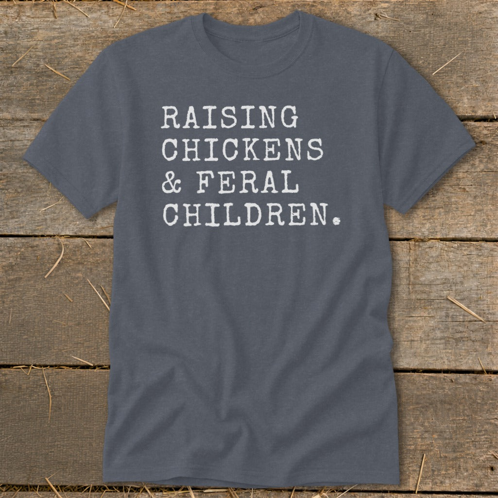 Dark gray t-shirt with white text reading "RAISING CHICKENS & FERAL CHILDREN."