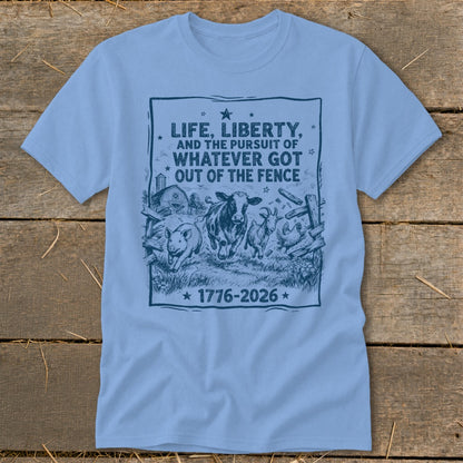 Light blue t-shirt with farm animals and text "Life, Liberty, and the Pursuit of Whatever Got Out of the Fence 1776-2026".