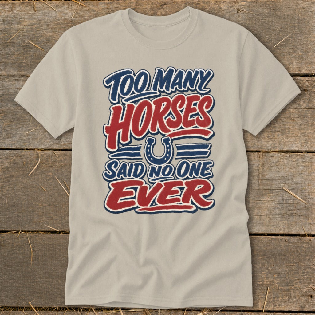 Light beige t-shirt with "TOO MANY HORSES SAID NO ONE EVER" text and horseshoe graphic.