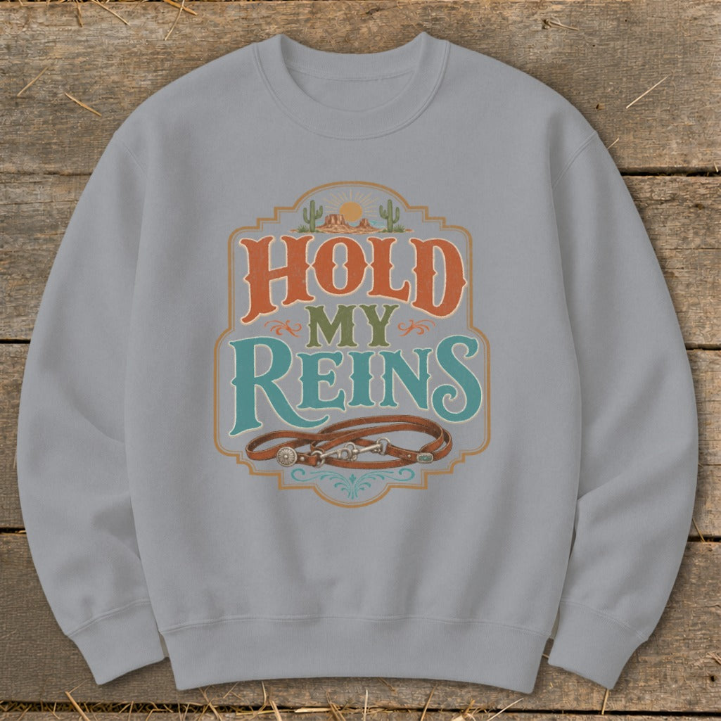 Light gray sweatshirt with "HOLD MY REINS" text and leather reins design.