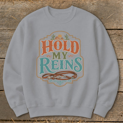 Light gray sweatshirt with "HOLD MY REINS" text and leather reins design.
