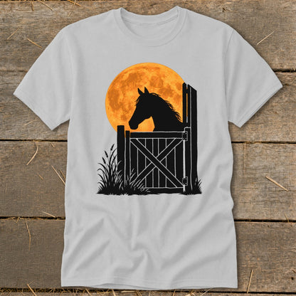 Light gray t-shirt featuring a graphic of a horse silhouette looking over a stable door against a large orange moon.