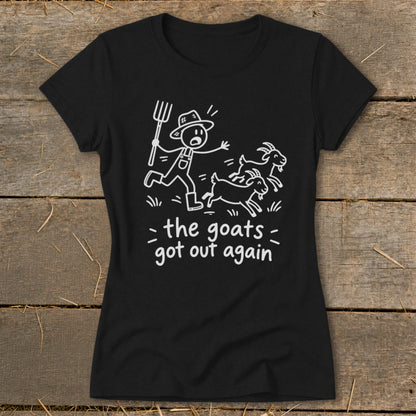 Black t-shirt with white illustration of a farmer chasing goats and text "the goats got out again".