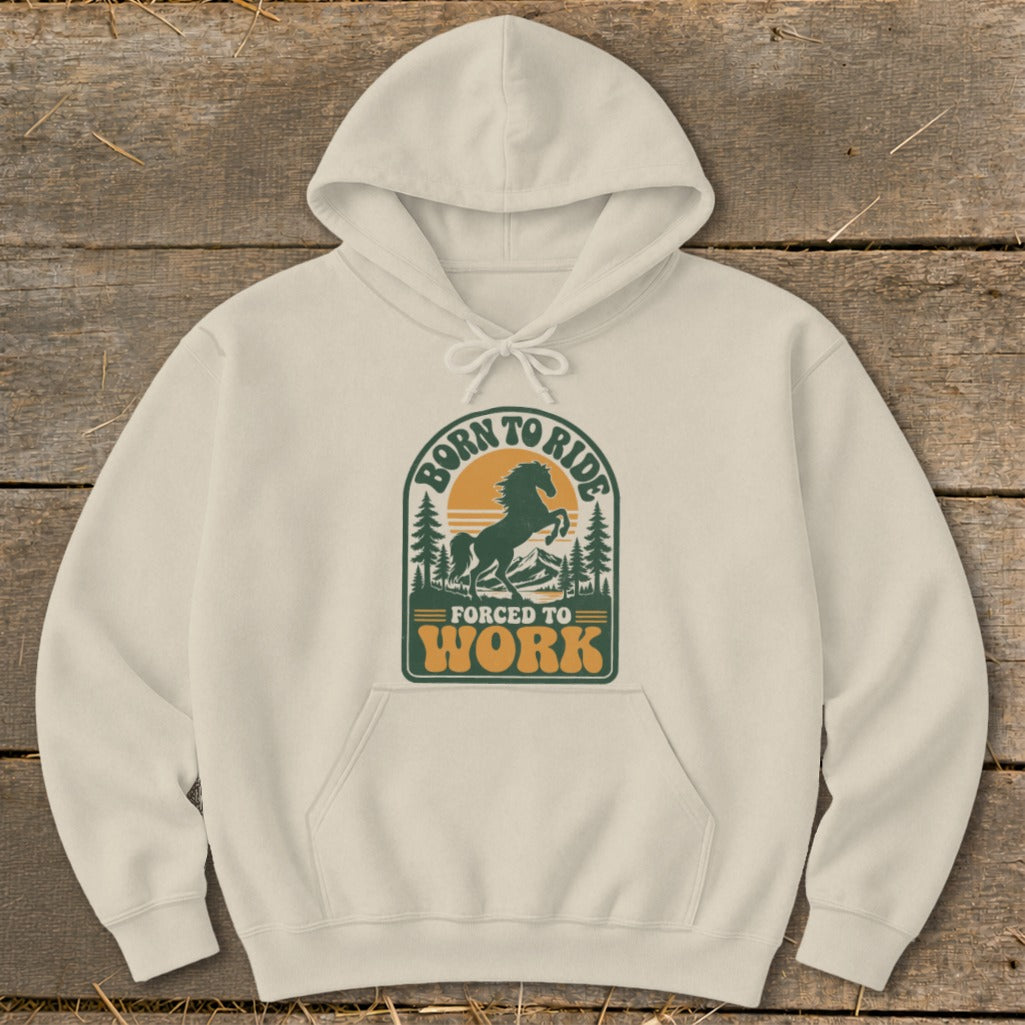 Cream hoodie with "Born to Ride, Forced to Work" graphic featuring a horse and mountains.