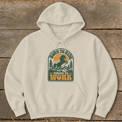 Cream hoodie with "Born to Ride, Forced to Work" graphic featuring a horse and mountains.