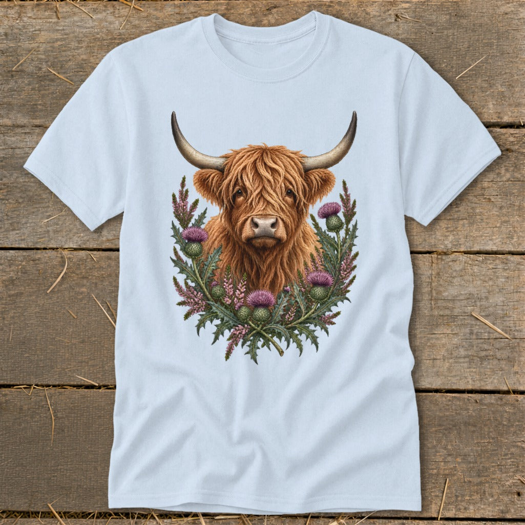Light blue t-shirt with a Highland cow and thistles graphic.