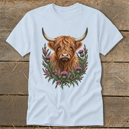 Light blue t-shirt with a Highland cow and thistles graphic.