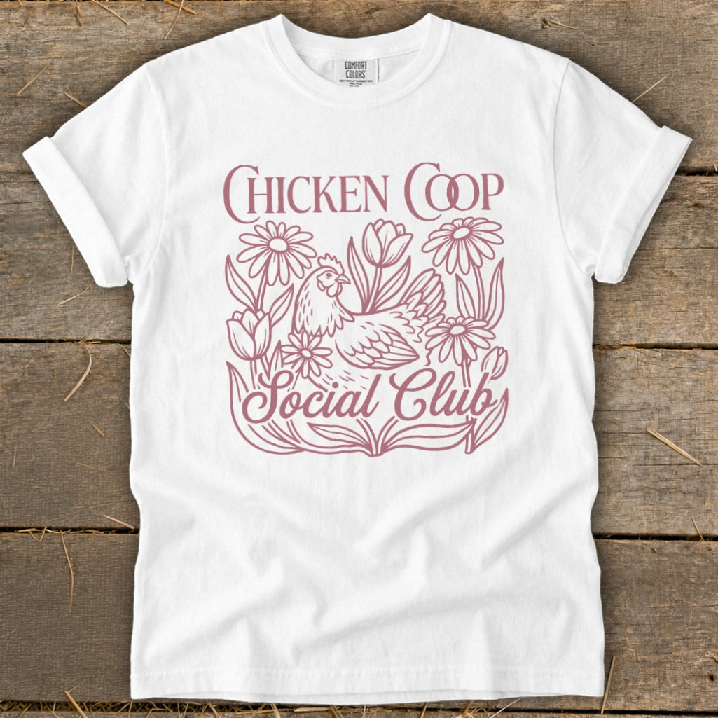 White t-shirt with pink "Chicken Coop Social Club" text and a chicken graphic.