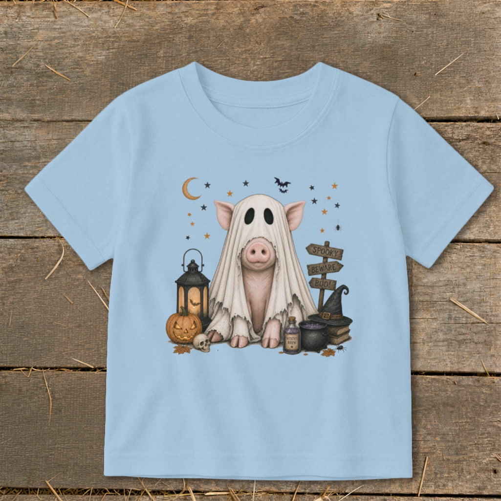 Pig in a ghost costume with Halloween decorations and "Spooky Beware Boo!" sign.