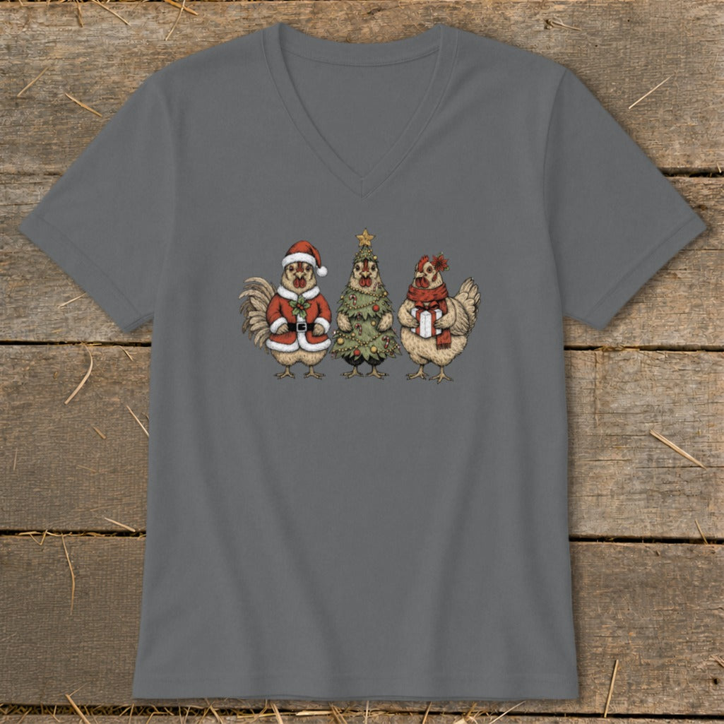 Three cartoon chickens are depicted in festive Christmas attire, one as Santa, one as a tree, and one holding a gift.