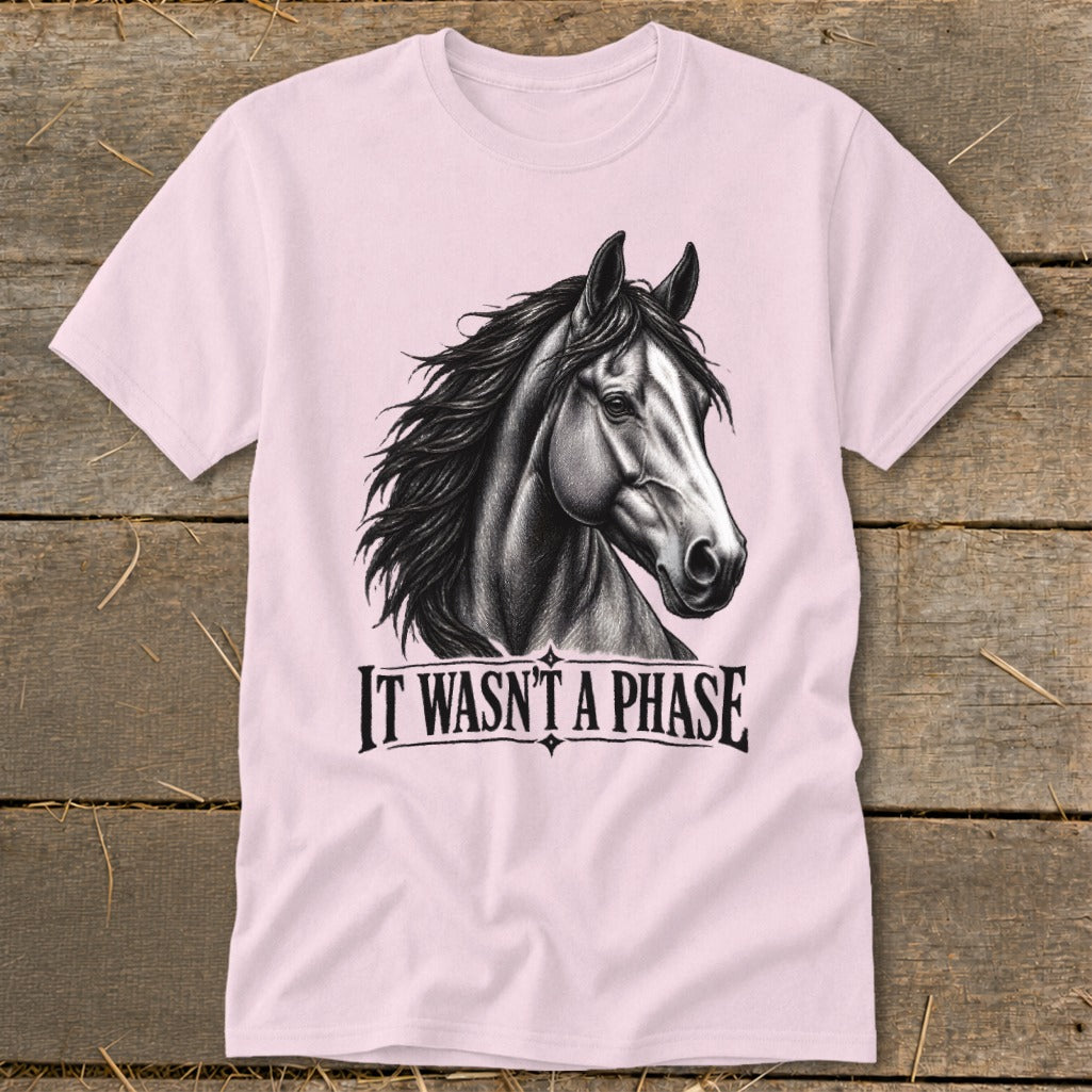 Pink t-shirt with a charcoal drawing of a horse's head and the text "IT WASN'T A PHASE".