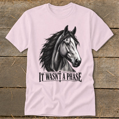 Pink t-shirt with a charcoal drawing of a horse's head and the text "IT WASN'T A PHASE".