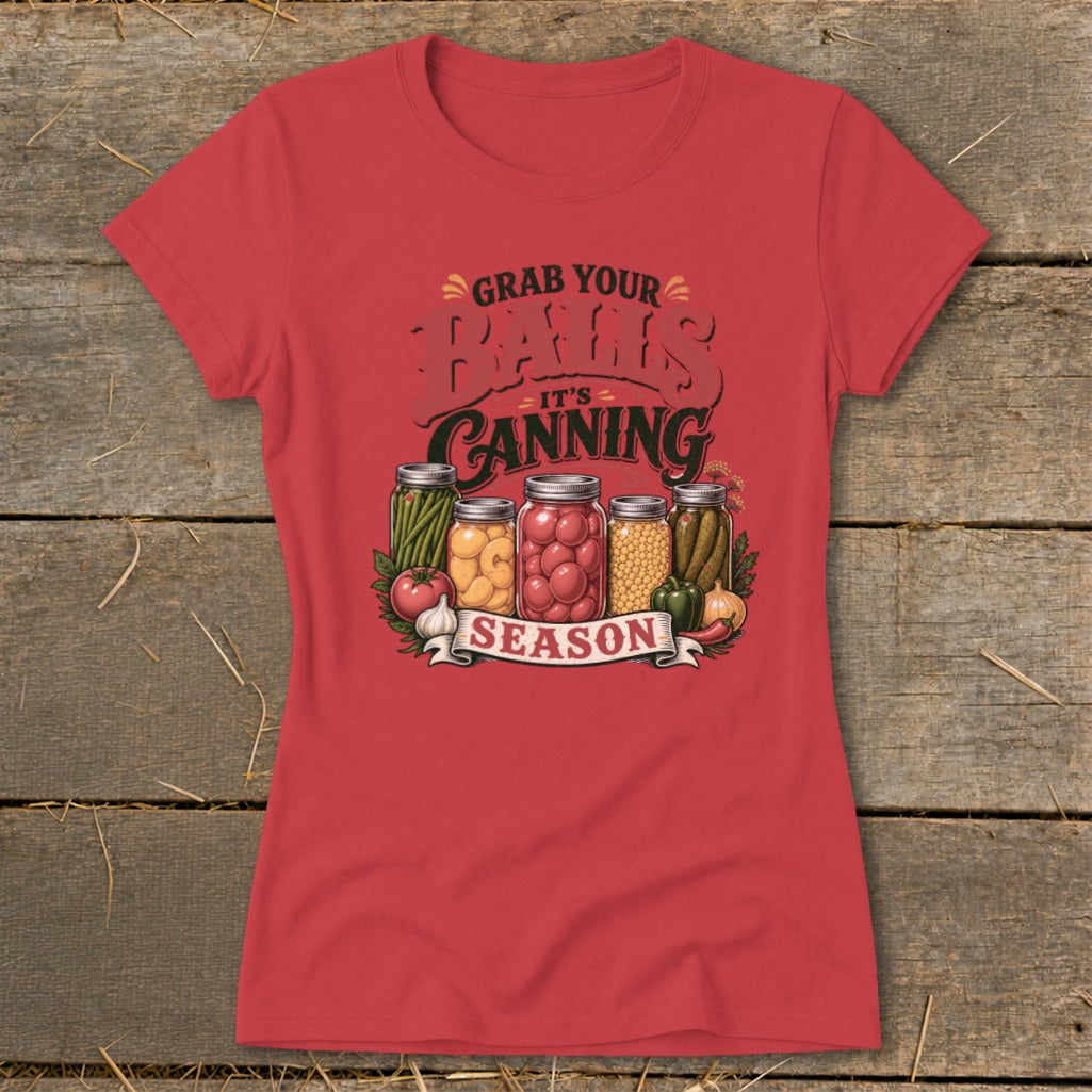 Red t-shirt with "Grab Your Jars It's Canning Season" graphic and canned vegetables.