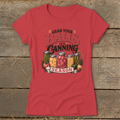 Red t-shirt with "Grab Your Jars It's Canning Season" graphic and canned vegetables.