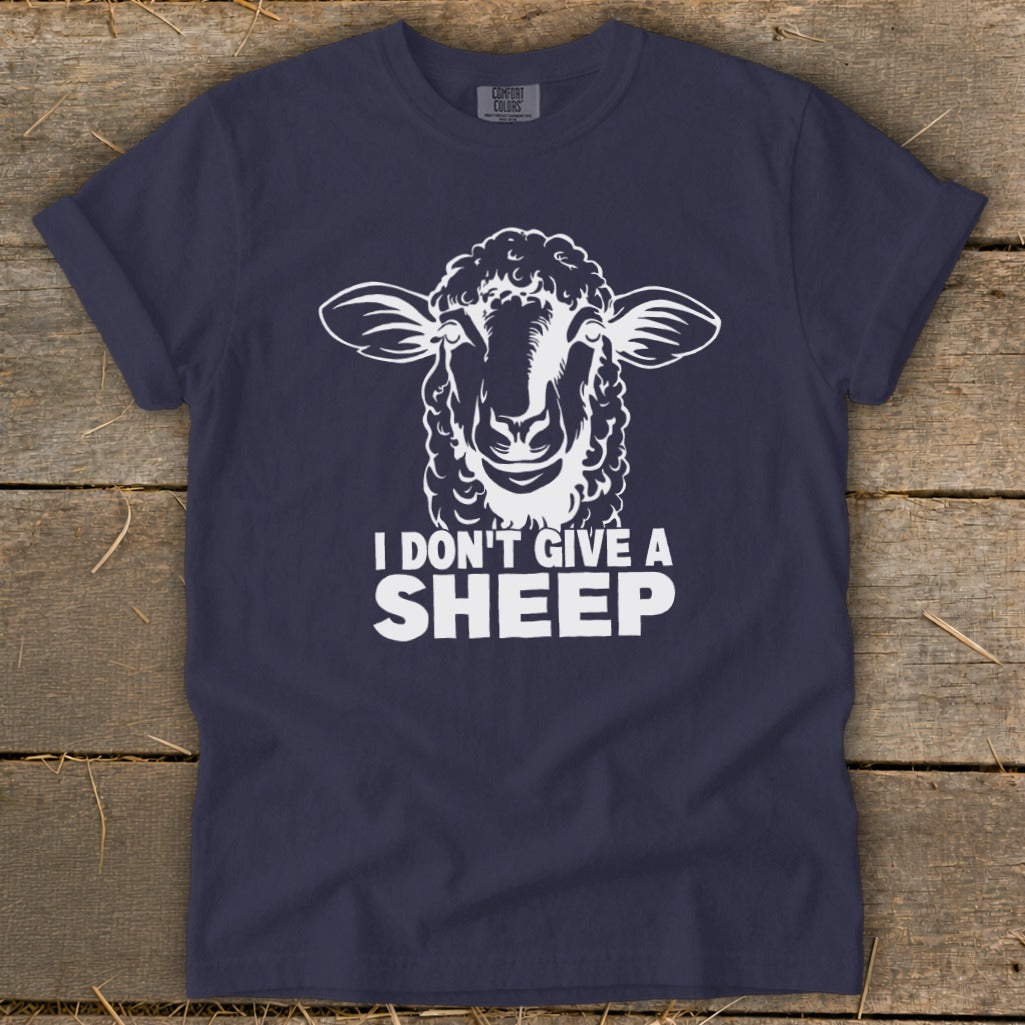 Navy t-shirt with white graphic of a sheep and text "I DON'T GIVE A SHEEP."