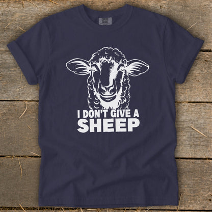 Navy t-shirt with white graphic of a sheep and text "I DON'T GIVE A SHEEP."