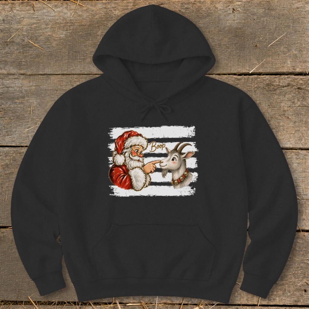 Santa Claus booping a goat's nose with the word "Boop"