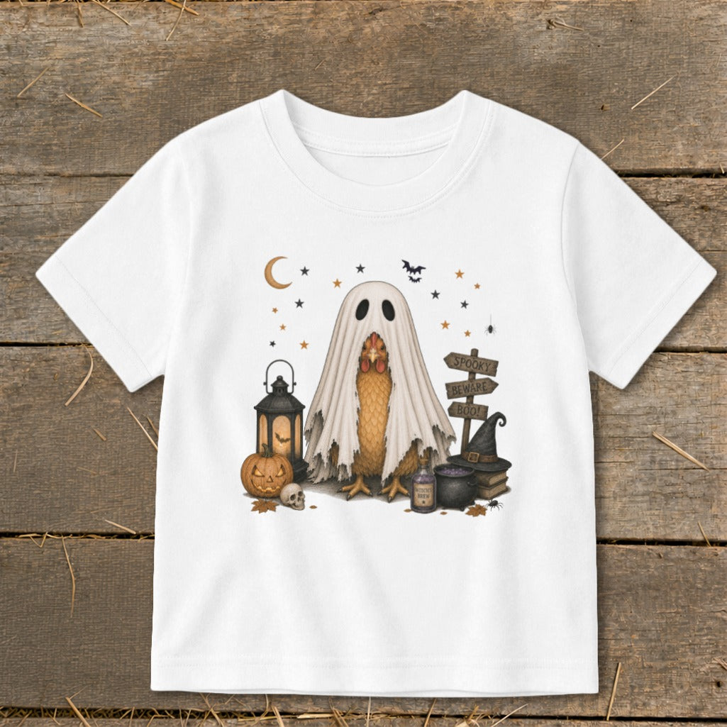 Chicken in a ghost costume with Halloween decorations and text.