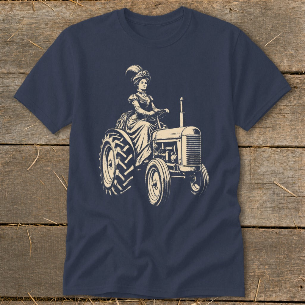 T-shirt graphic of a woman in vintage attire driving a tractor.