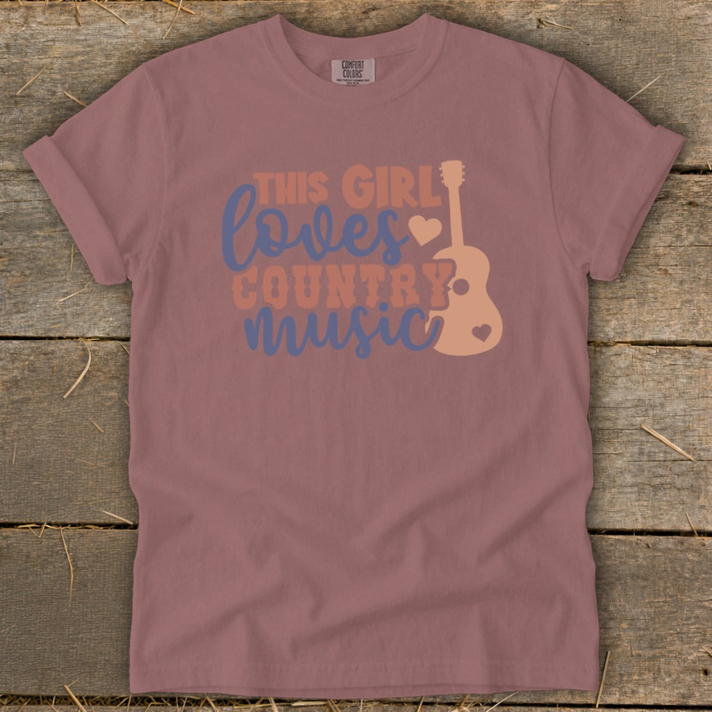 Mauve t-shirt with "This girl loves country music" graphic and guitar illustration.