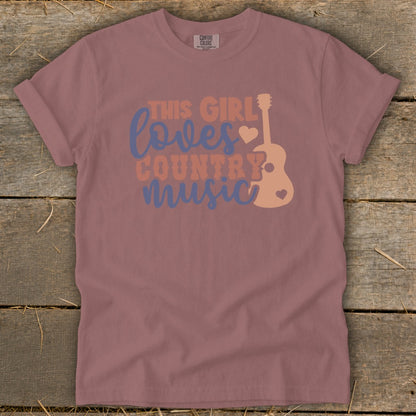 Mauve t-shirt with "This girl loves country music" graphic and guitar illustration.