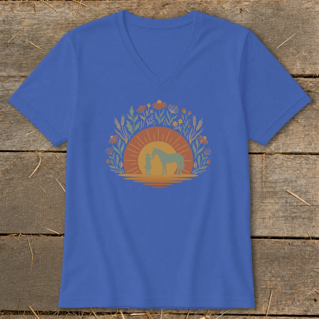 Royal blue v-neck t-shirt with a girl and horse silhouette at sunset surrounded by wildflowers.