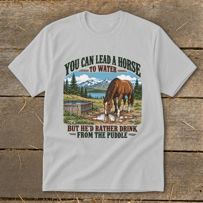 Light gray t-shirt featuring a graphic of a horse drinking from a puddle with mountain text.