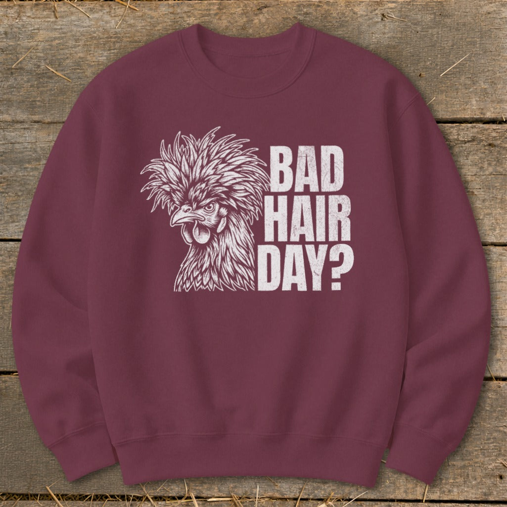 Burgundy sweatshirt with a white line drawing of a fluffy chicken and text "BAD HAIR DAY?".