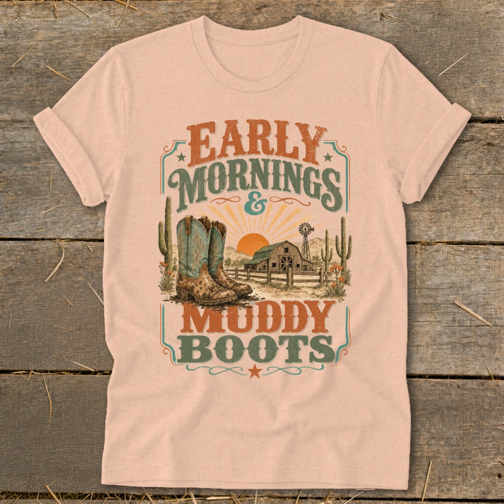 Shirt with "Early Mornings & Muddy Boots" text, boots, barn, and desert scene graphic.