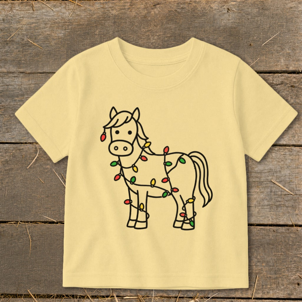 Children's yellow t-shirt with a cartoon horse wrapped in Christmas lights.