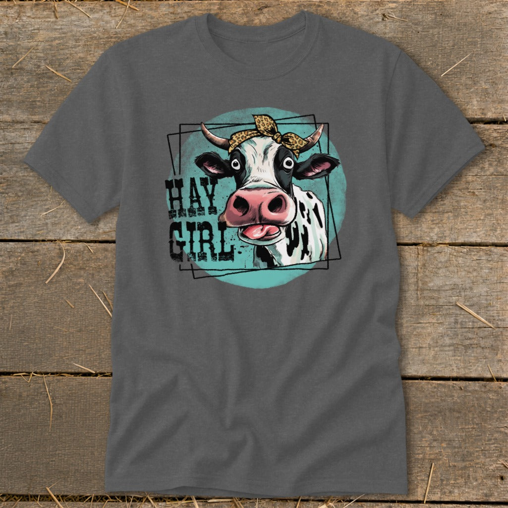 Gray t-shirt featuring a cartoon cow with a bandana and text that says "Hay Girl".