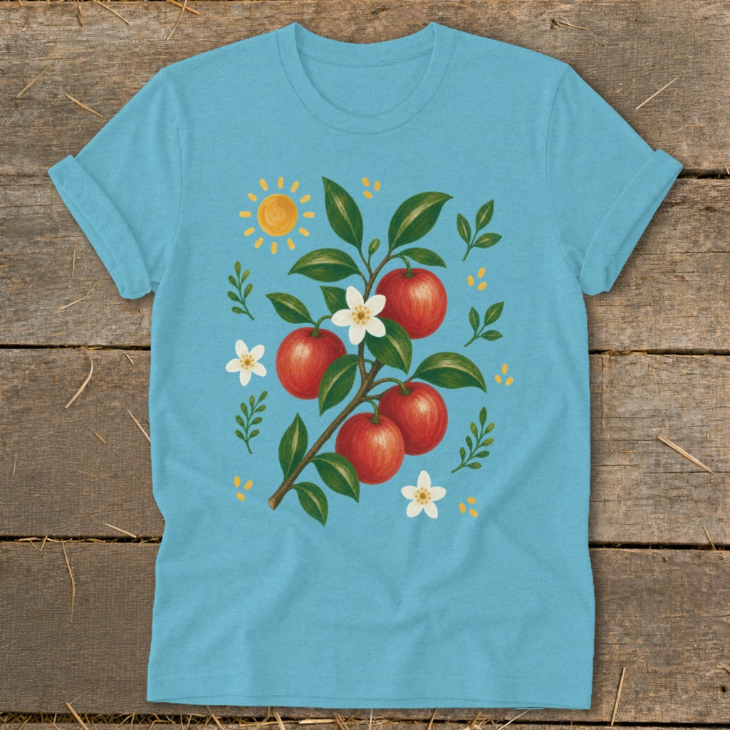 Blue t-shirt with illustration of apples, flowers, and a sun on a branch.