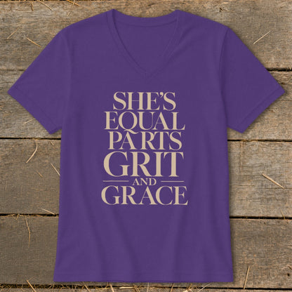Purple v-neck t-shirt with text "SHE'S EQUAL PARTS GRIT AND GRACE".