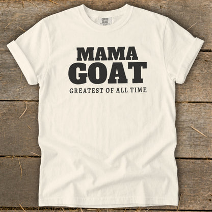 Cream t-shirt with black text reading "MAMA GOAT GREATEST OF ALL TIME."