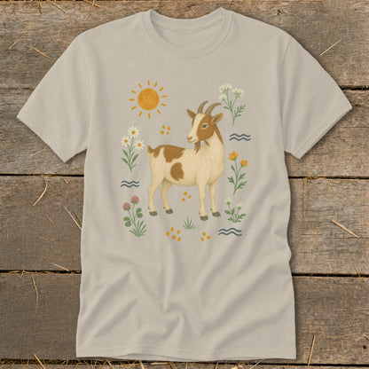 T-shirt with a drawing of a brown and white goat surrounded by flowers and a sun.
