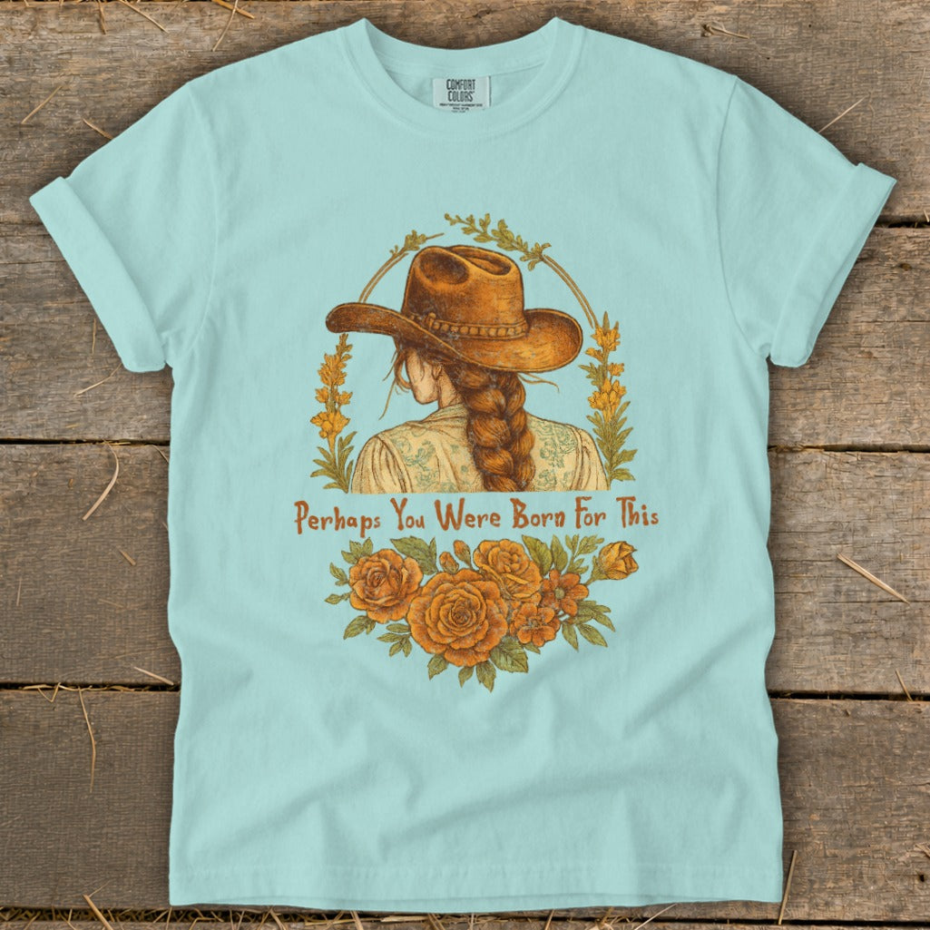 Light blue t-shirt with a woman in a cowboy hat and the text "Perhaps You Were Born For This".