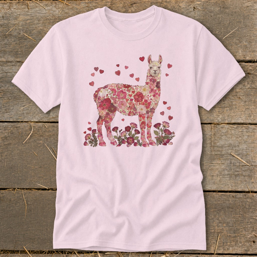 Pink t-shirt with a llama made of flowers, surrounded by hearts.