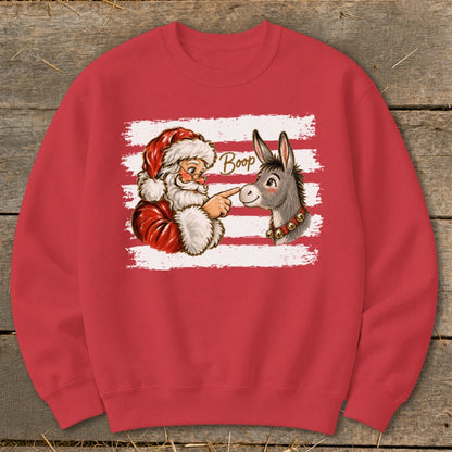 Red crewneck sweatshirt with Santa booping a donkey's nose, with the word "Boop."