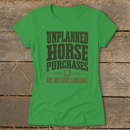 Green t-shirt with "Unplanned Horse Purchases Are My Love Language" text.