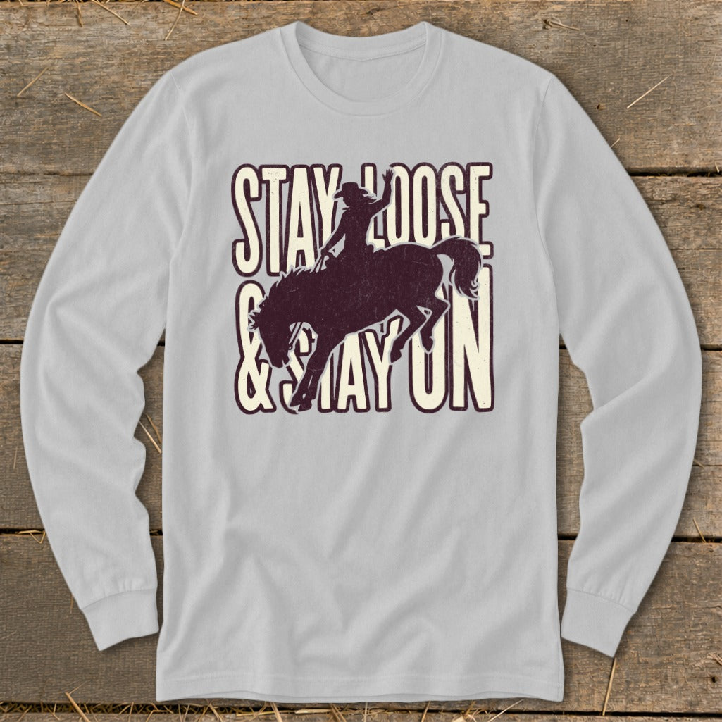 Light grey long sleeve shirt with rodeo graphic and "Stay Loose & Stay On" text.