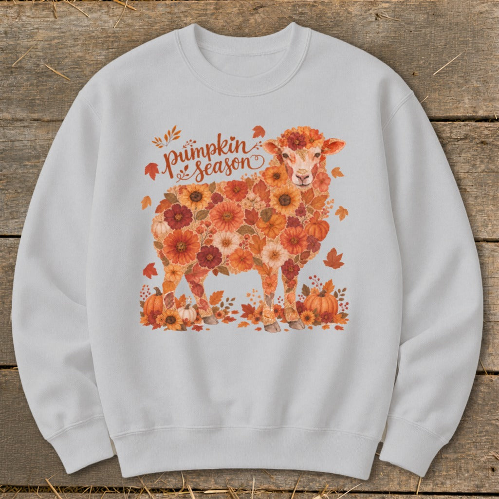 Sheep graphic with floral details and "Pumpkin Season" text on a light sweatshirt.