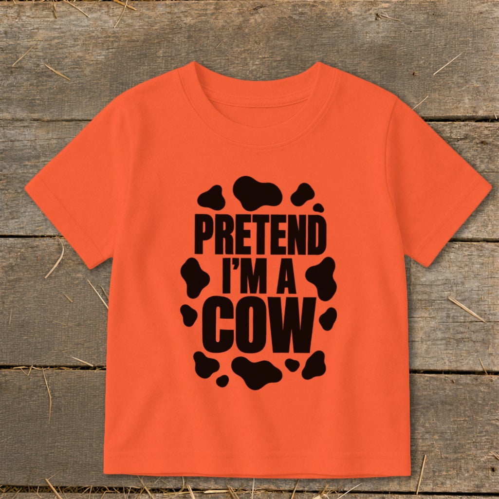 Orange t-shirt with black "Pretend I'm a Cow" text and cow spots.