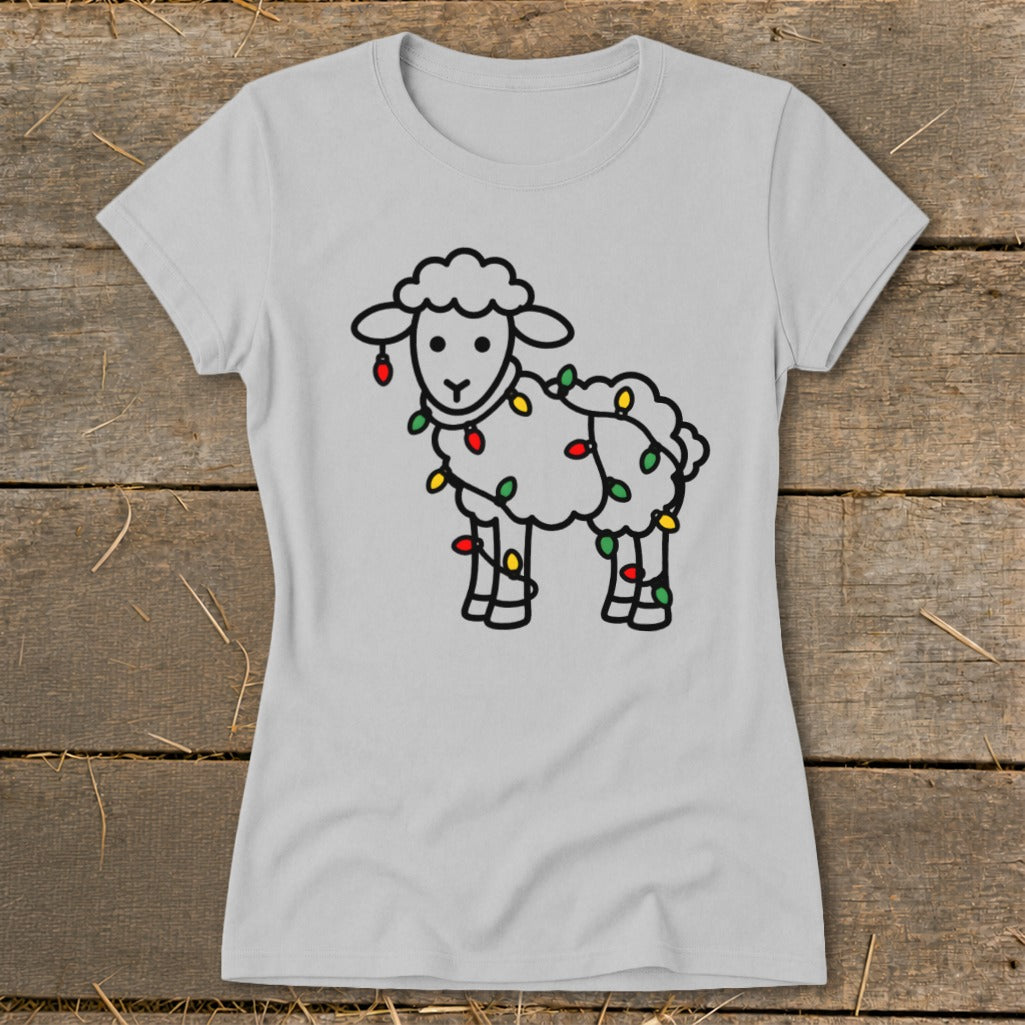 A light gray t-shirt featuring a black outline graphic of a sheep tangled in colorful Christmas lights.