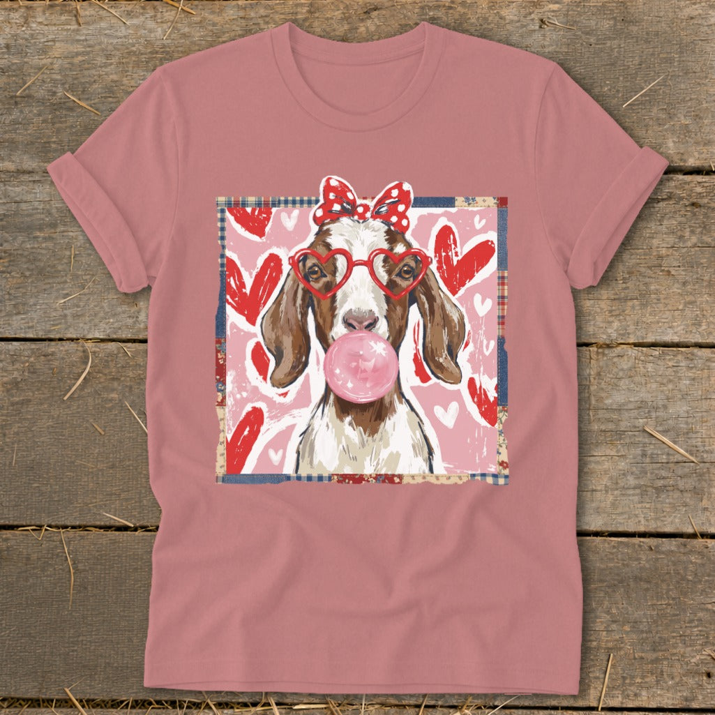 Goat wearing heart glasses and a bow blowing bubblegum on a pink heart background.