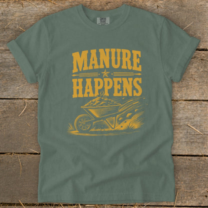 Green t-shirt with yellow "Manure Happens" text and wheelbarrow graphic.