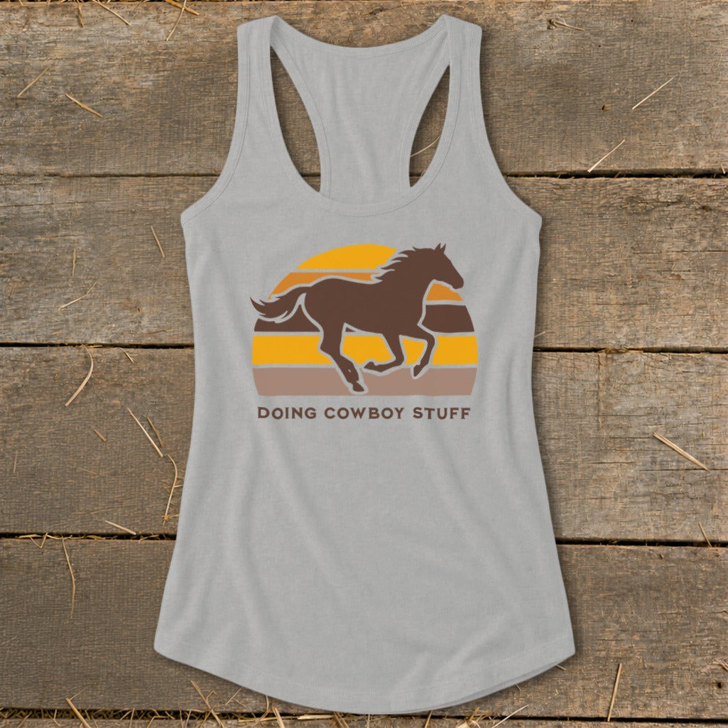 Grey tank top with a running horse graphic and "Doing Cowboy Stuff" text.