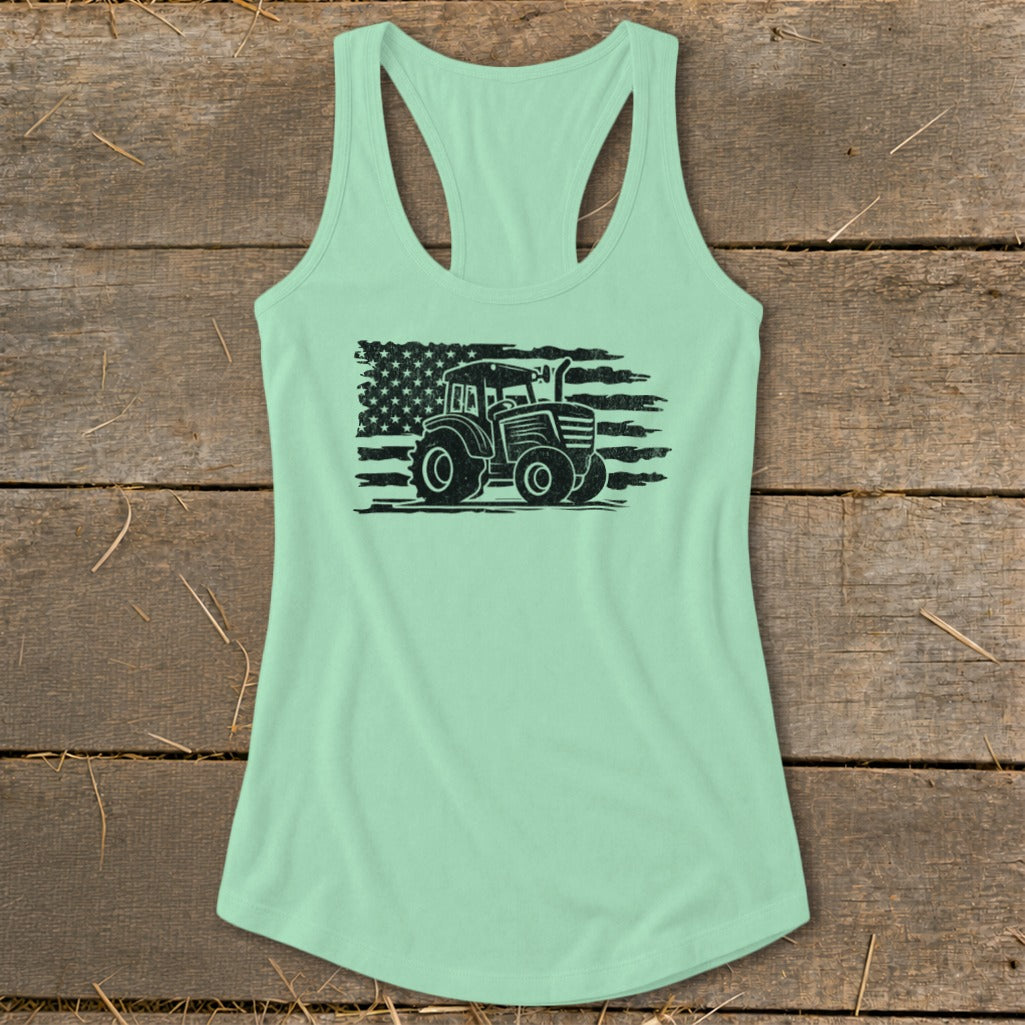 Light teal tank top with a distressed black tractor and American flag graphic.